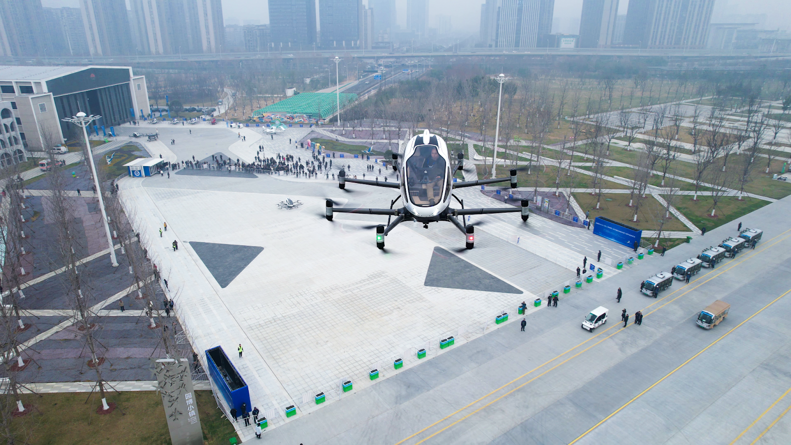 A single passenger flies in EHang’s autonomous air taxi above Hefei’s Luogang Central Park. 